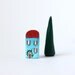 Little Italian clay house and tree - turquoise house with red roof, red shutters shutters and flowers