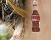 Coca-Cola bottle earrings.