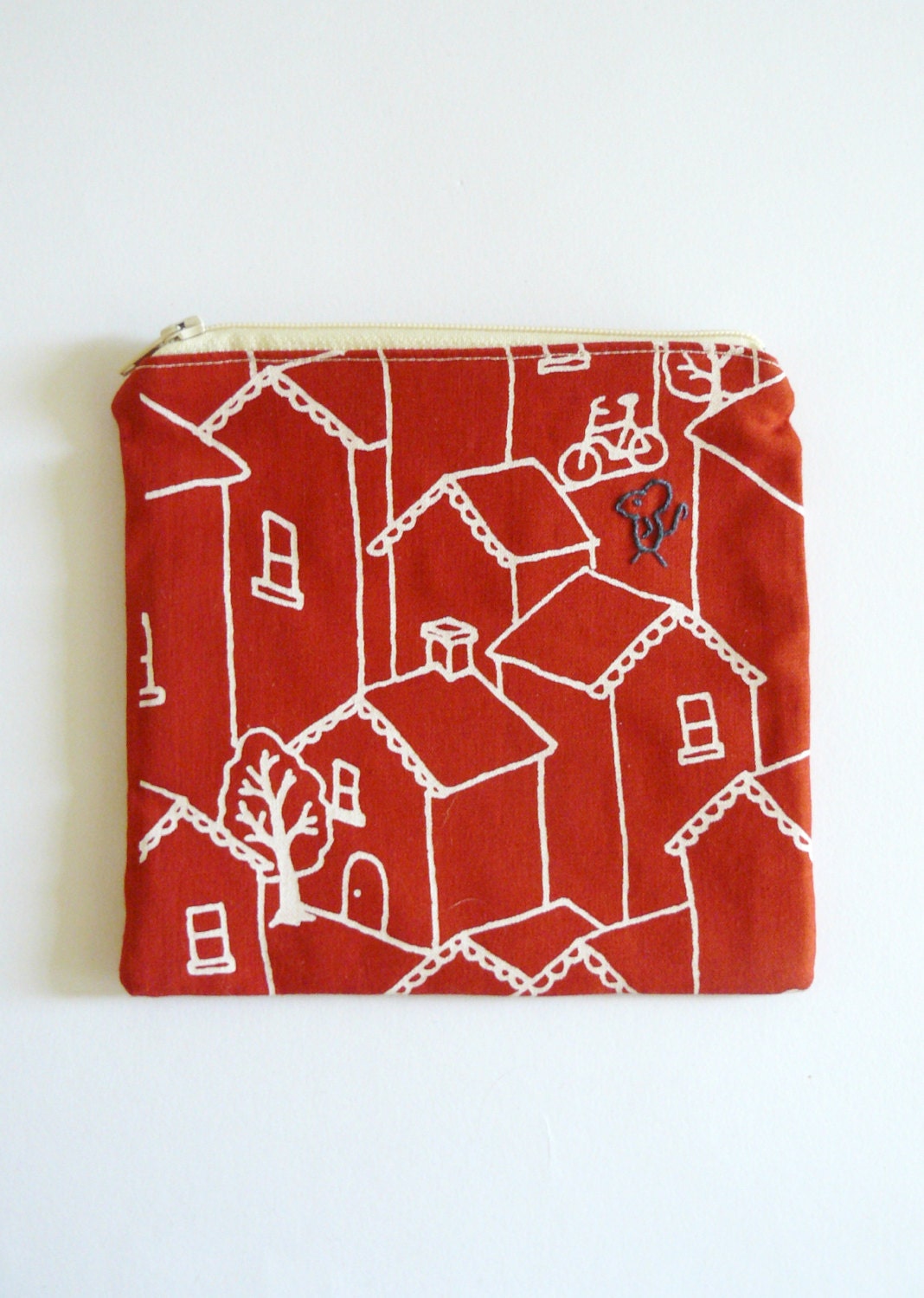 zipper pouch, purse. red bird and mouse embroidery in navy blue with white houses on cherry sustainable cotton designed fabric.