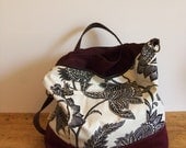 Boho chic Convertibel Diper bag in black & white canvas with burgundy wine vegan suede.
