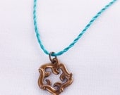 Crashing Waves mini aged bronze pendant with cord