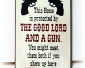 This home is protected by the Good Lord and a Gun...wood sign
