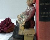 country girl figurine, cast iron, woman sitting on bench, heavy figurine, home decor
