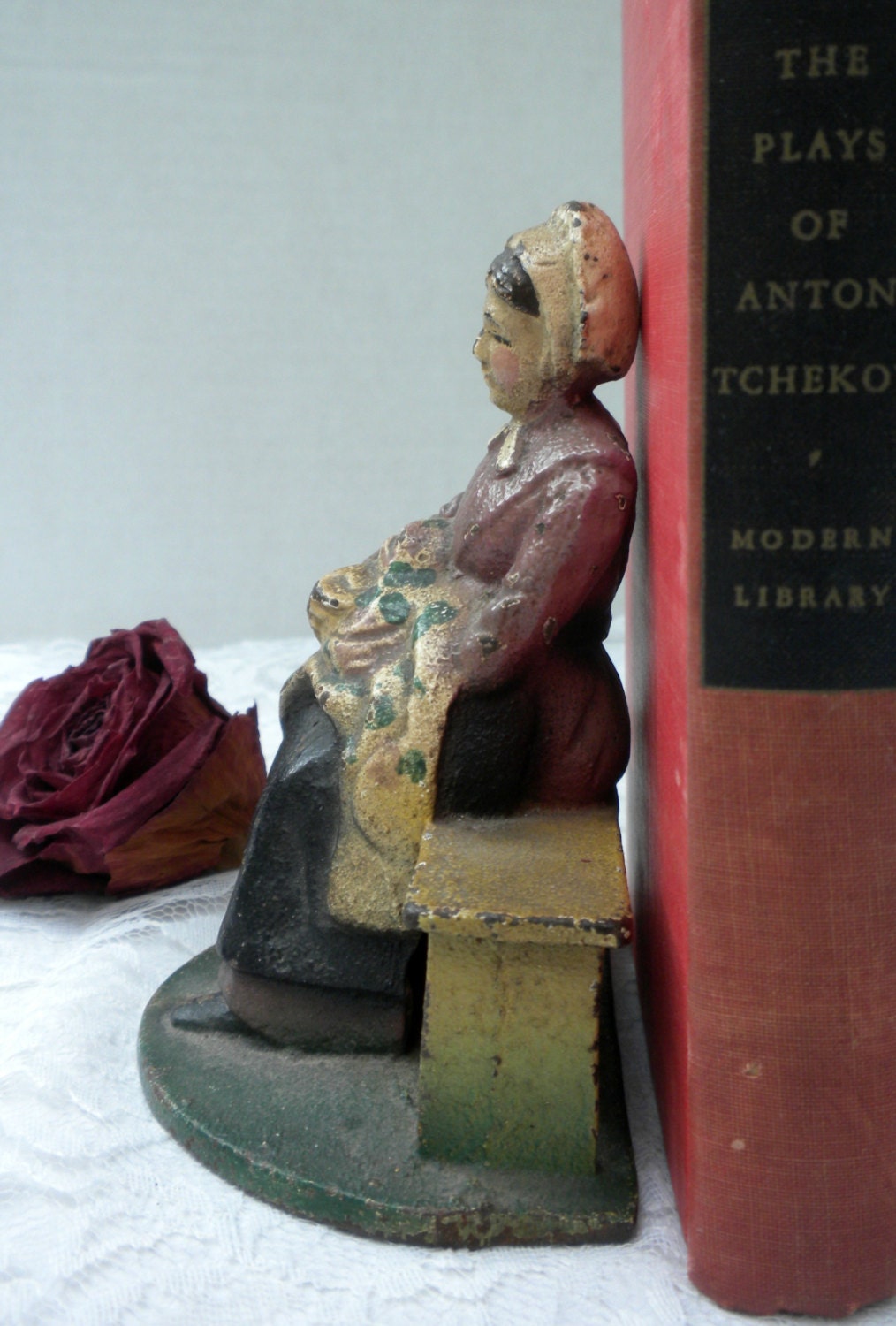 country girl figurine, cast iron, woman sitting on bench, heavy figurine, home decor