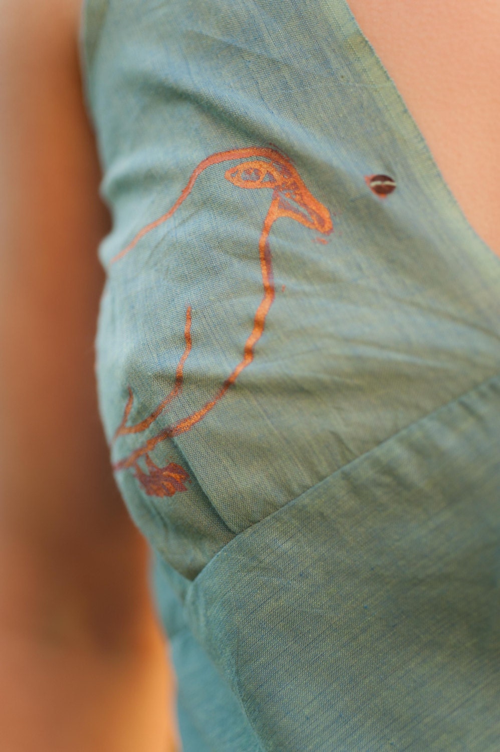 Flyaway sleeveless blouse
