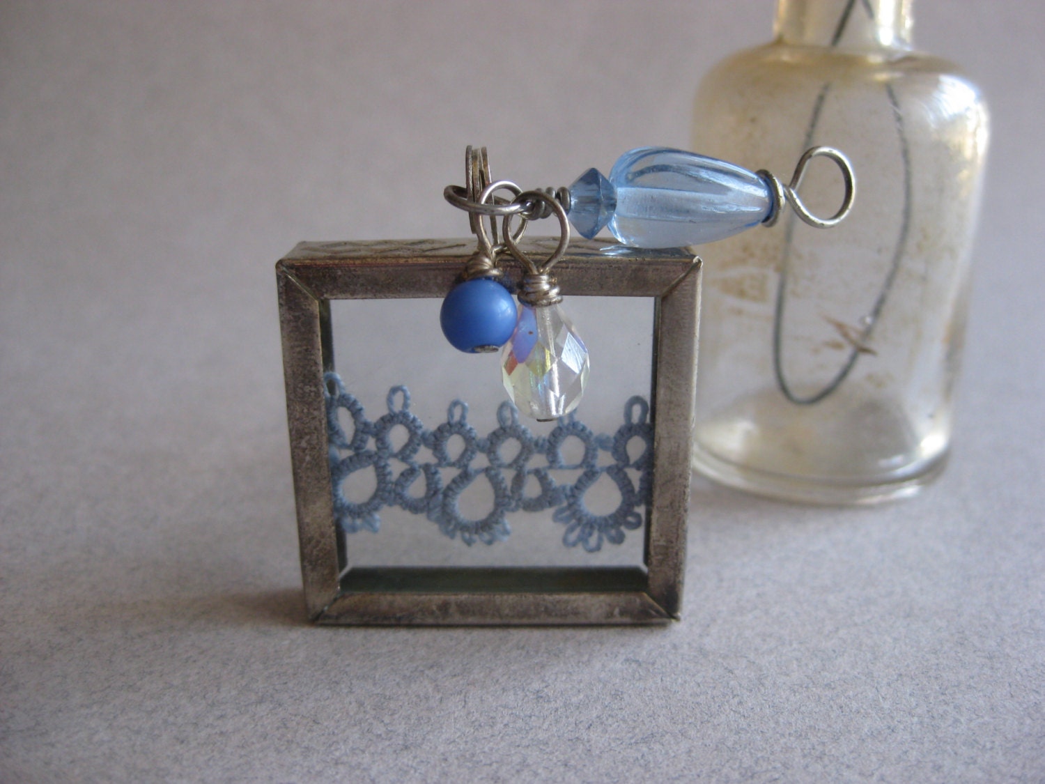 Blue Tatted Edging Between Glass in Silver Frame Pendant with Beaded Accents