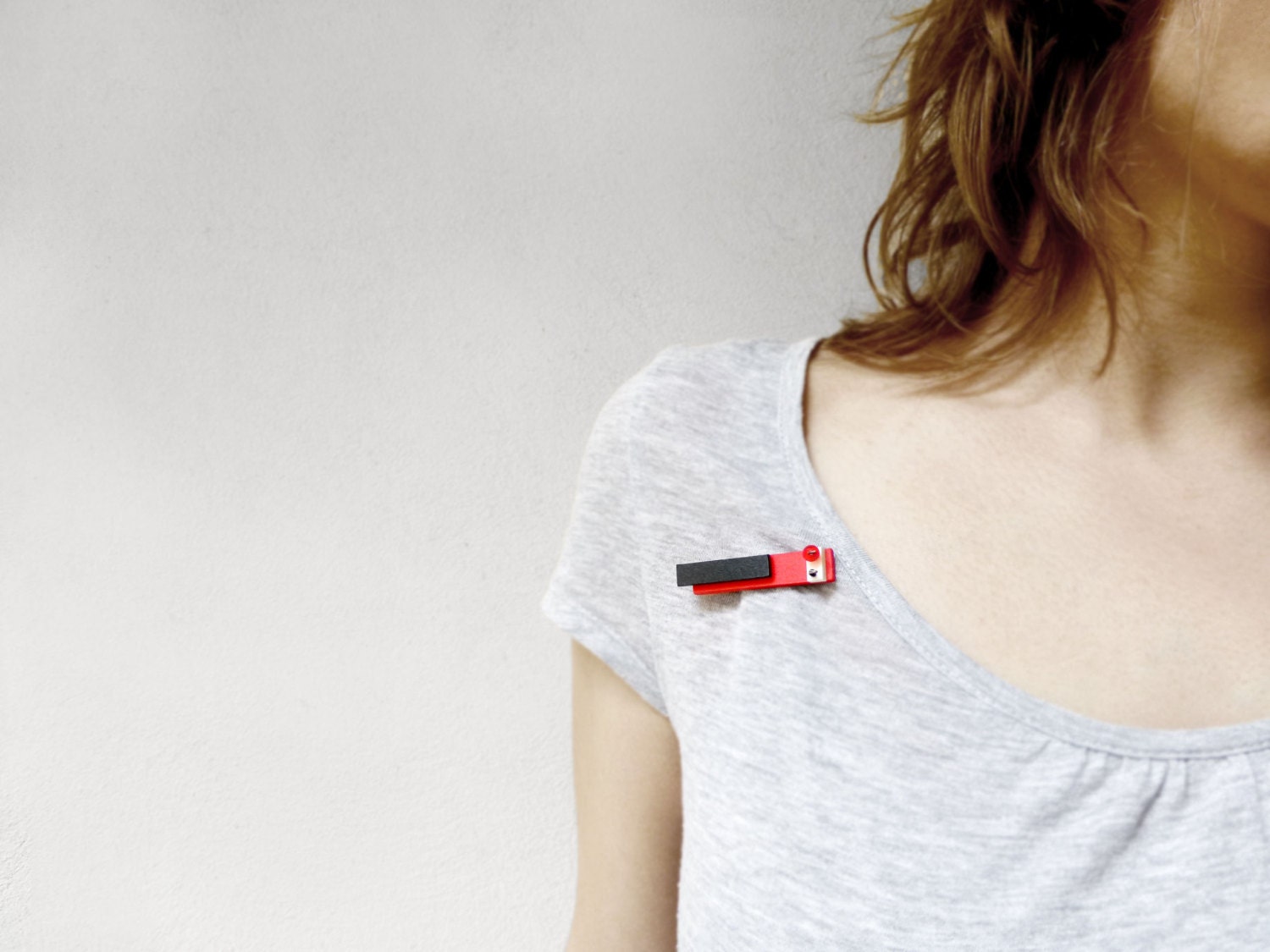 geometric bauhaus style minimal brooch with red, black and white plastic - contemporary jewelry