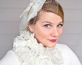 Lady Butterfly ivory birdcage veil and fascinator