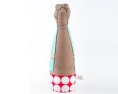 Curly brown Lady wearing  turquoise floral  jacket ,red retro skirt with circles. Mother, aunt , or grandmother - handmade fabric doll