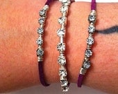 Wire wrapped rhinestone bling on purple leather stackable bracelets