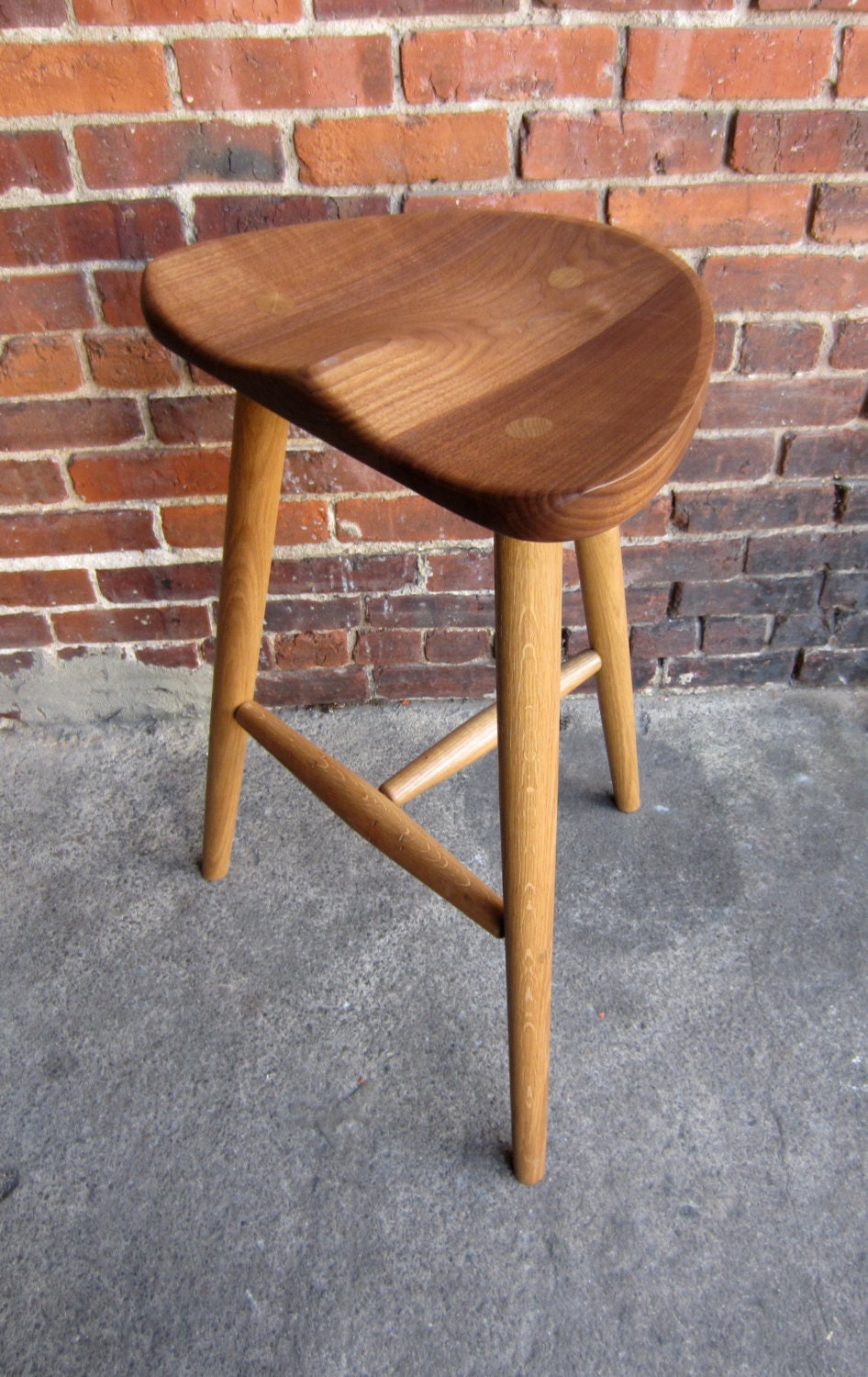 Stool made in sustainably sourced black walnut.