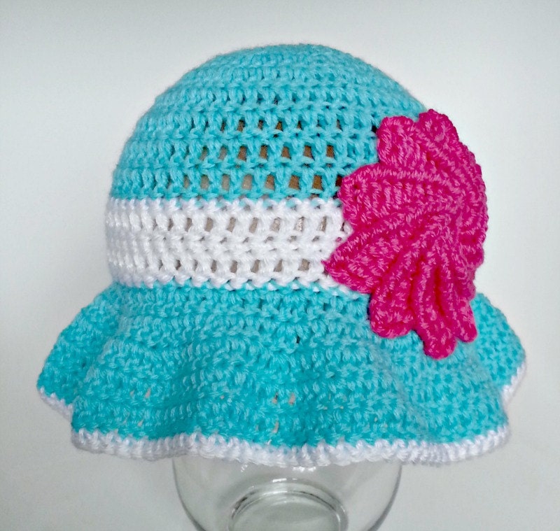 Crocheted ruffled sunhat with pinwheel flower