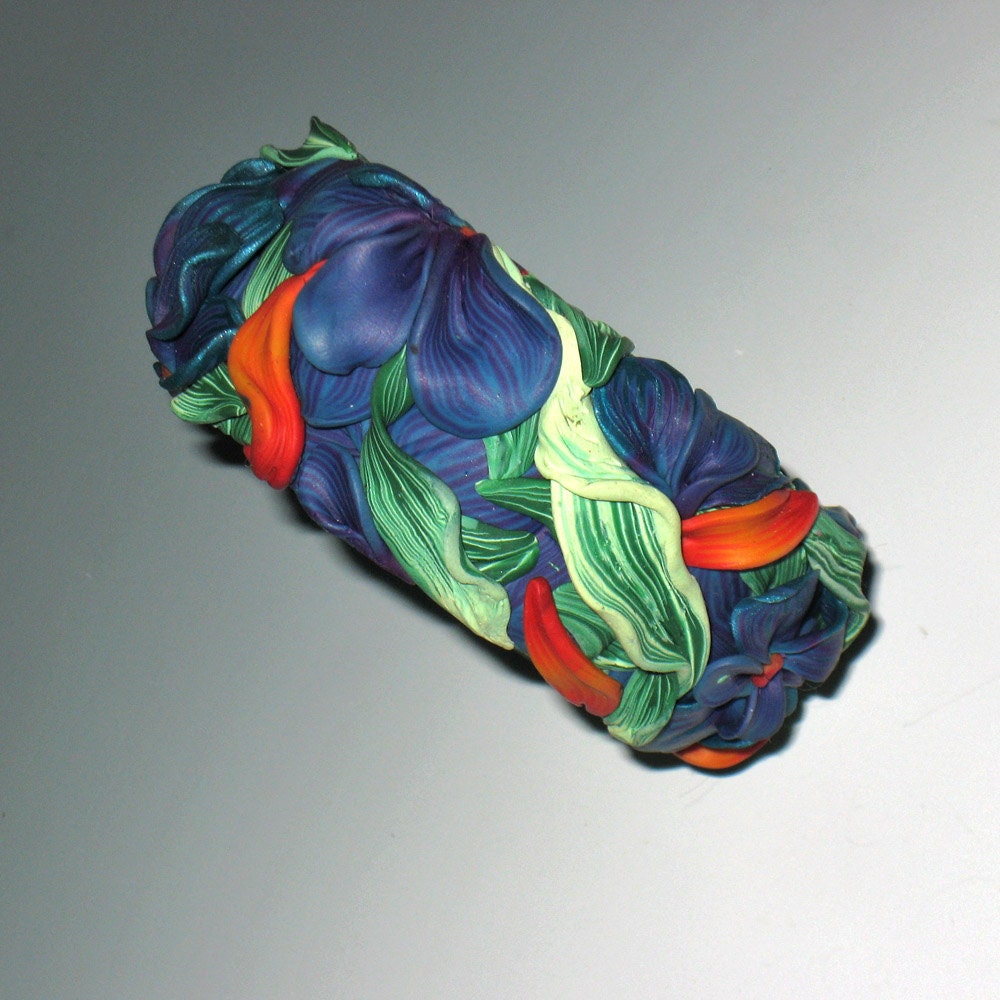 Polymer clay bangle bracelet , sculpted flower garden. Blue, lavender,  red, gold, orange,  green.