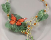 Orange butterfly necklace. Romantic wedding necklace with green leaves. Unique fiber art necklace. Whimsical woodland wedding necklace.