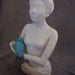 Woman Holding Blue Bird Nest in Hair Calm White "Resting Bird"