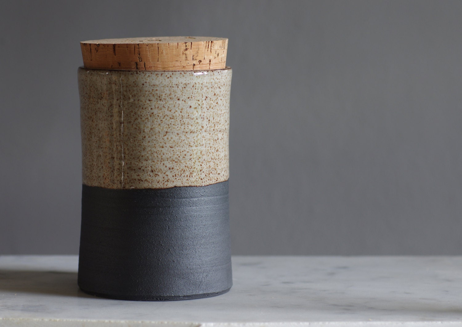 tall straight canister. black stoneware jar with white glaze. kitchen container with cork modern minimal folk pottery ceramic