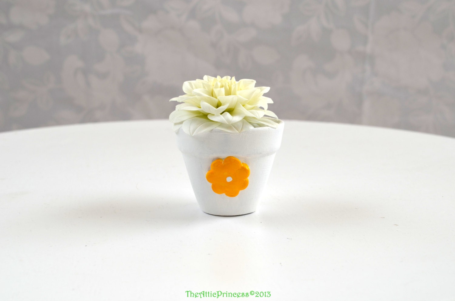 Miniature white planter with yellow flower, spring summer home decoration