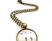 Sheet music necklace, a sheet music pendant on a brass chain