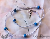brynn. a simple rope & turquoise beaded wrap bracelet with feather charm.