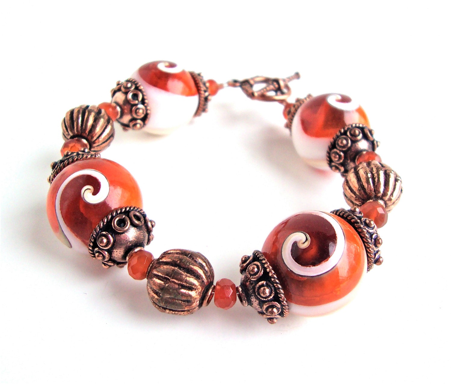 Sunset orange conk shell bracelet - chunky statement bracelet - copper and orange bracelet by Sparkle City Jewelry