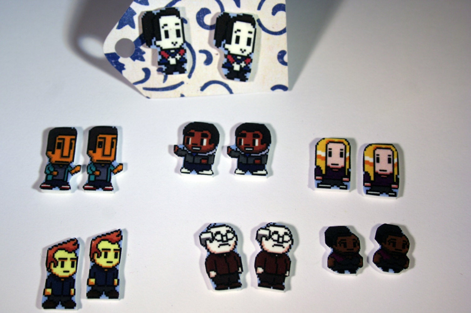 Community 8 bit earrings.