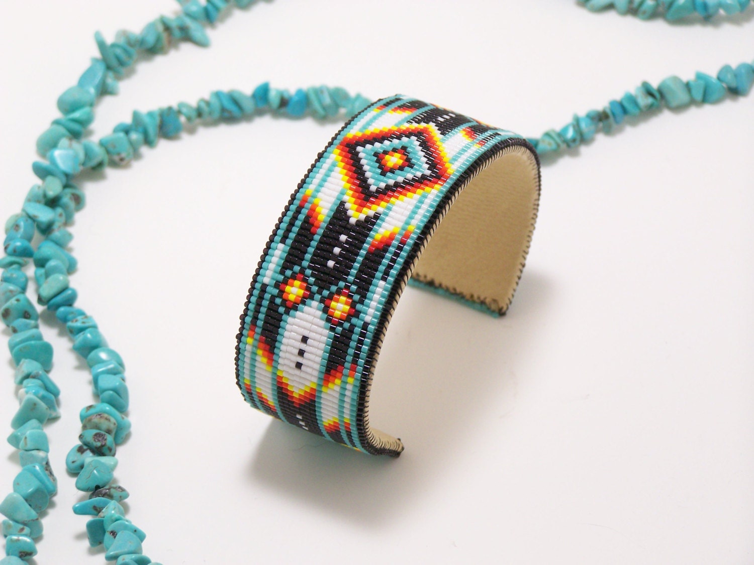 Native American Beaded Cuff Bracelet In Turquoise, and With The Fire Colors Of The Southwest by LJ Greywolf
