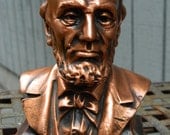 Vintage Abraham Lincoln Copper Colored Metal Savings Bank from Lincoln First Federal