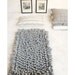 P A L O M I T A  hand-loomed wool bouclé area rug in  G R E Y