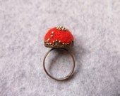 Felted ring . Needle felted Carrot color wool , hand sewn metallic mint green seed beads on antique Brass Adjustable Ring