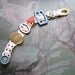 Antique Button & Buckle Bracelet, Bakelite, Old Lace, Teal Blue, Green, Pink, Mother of Pearl, Pretty