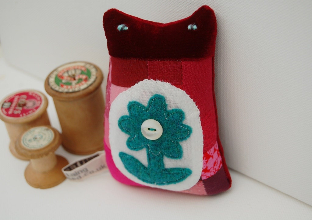A small ornamental textile kitten called 'Georgie'