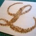 Baby Nursery Button Letter Monogram on Silk -- Taupe Tan Buttons on Light Pink Silk -- Ready-to-Frame (frame not included)