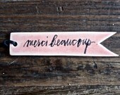 gift tag (merci beaucoup. pink).