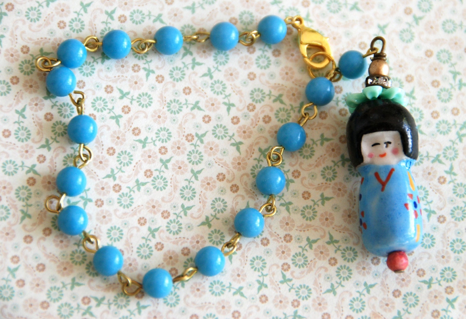 Petite Ming. vintage blue glass beaded,asian doll charm bracelet. Tiedupmemories