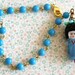 Petite Ming. vintage blue glass beaded,asian doll charm bracelet. Tiedupmemories