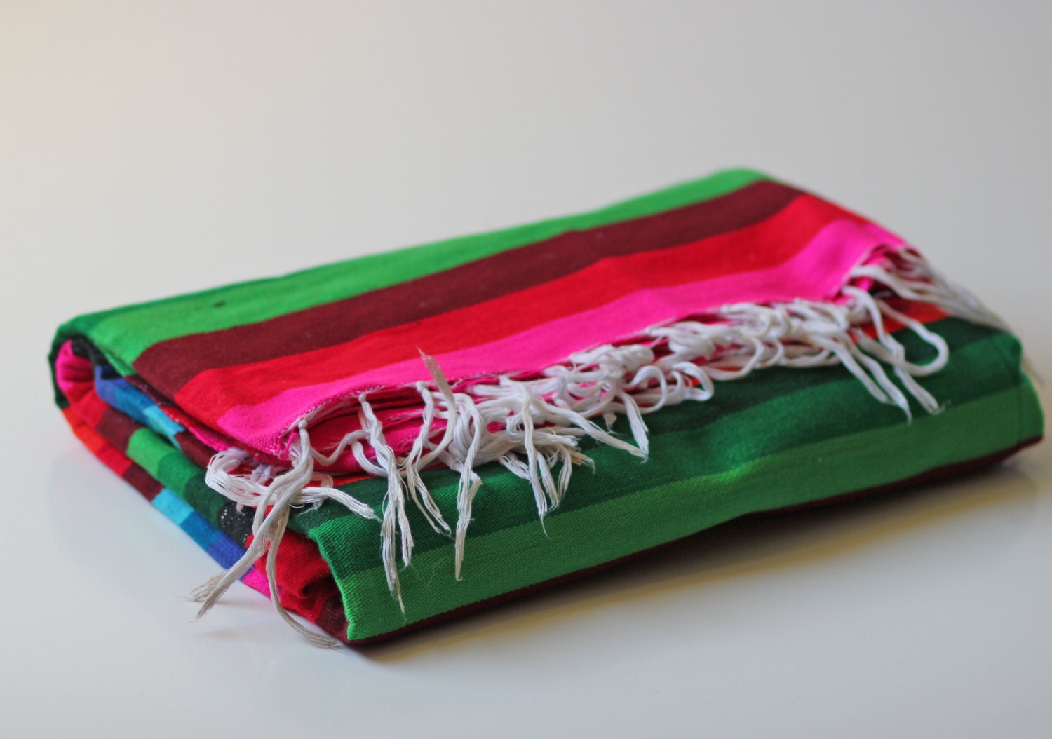 multi colored striped serape mexican blanket