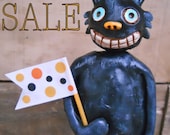 Black Halloween Cat with Polka Dot Flag Original Folk Art Sculpture