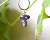 Little purple polka-dot mushroom necklace:  Glass pendant, recycled chain.