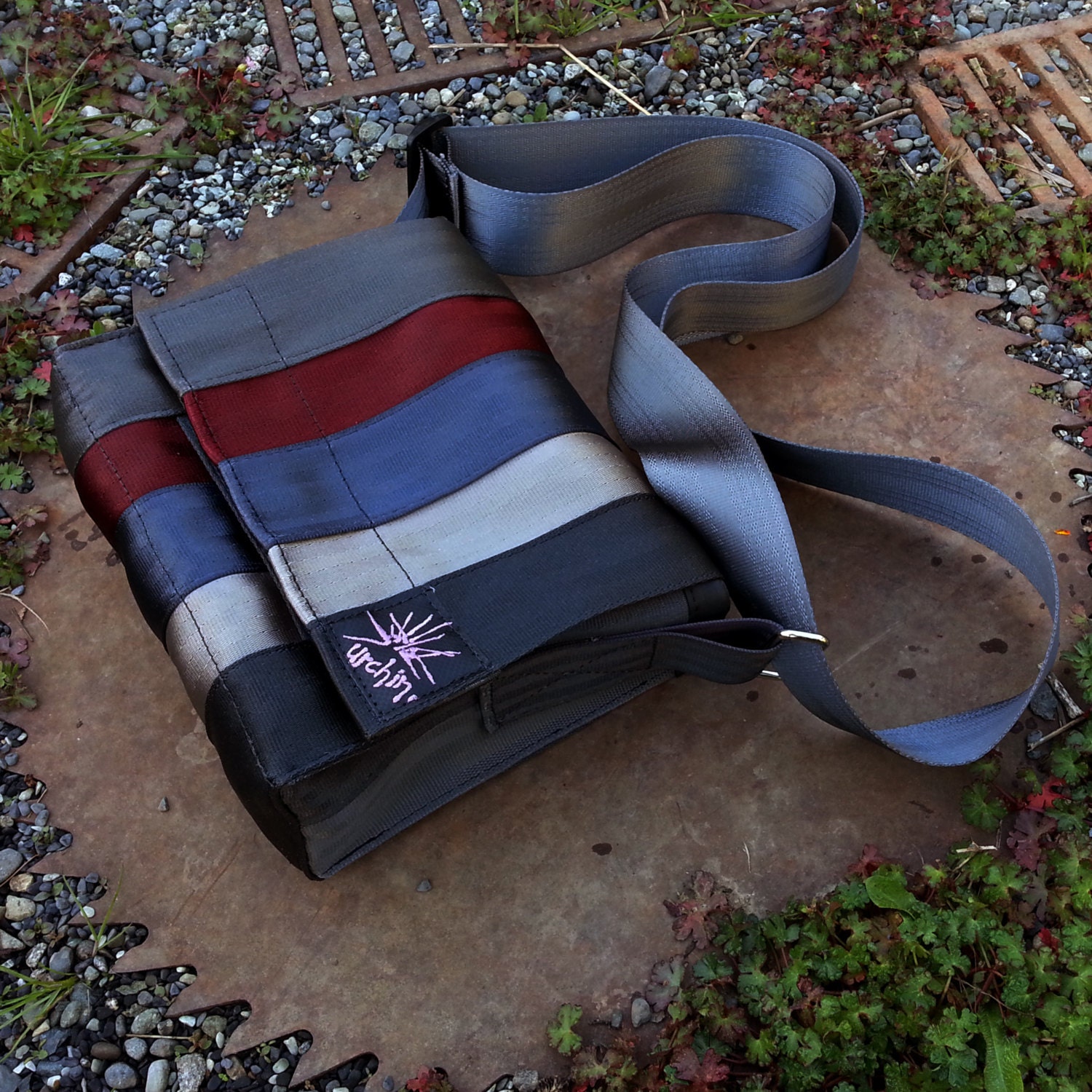 Purse handbag made from reclaimed seatbelts.