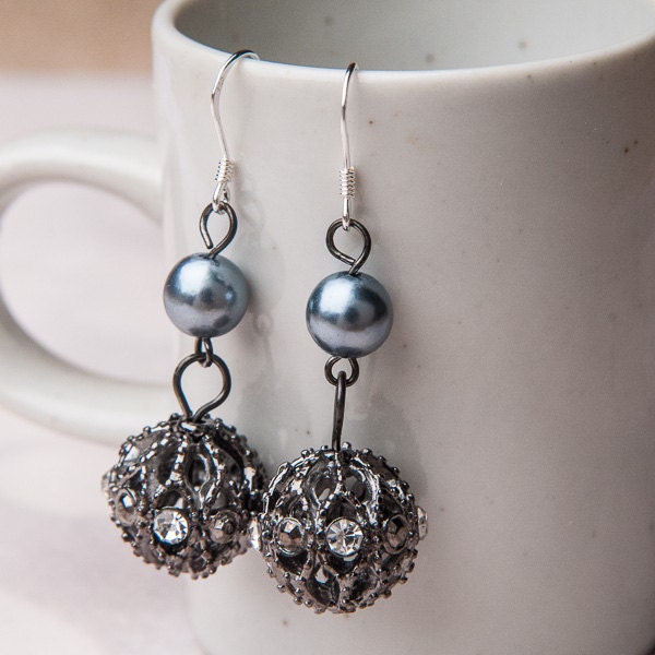 SOLD...Dangling dark blue glass bead earrings
