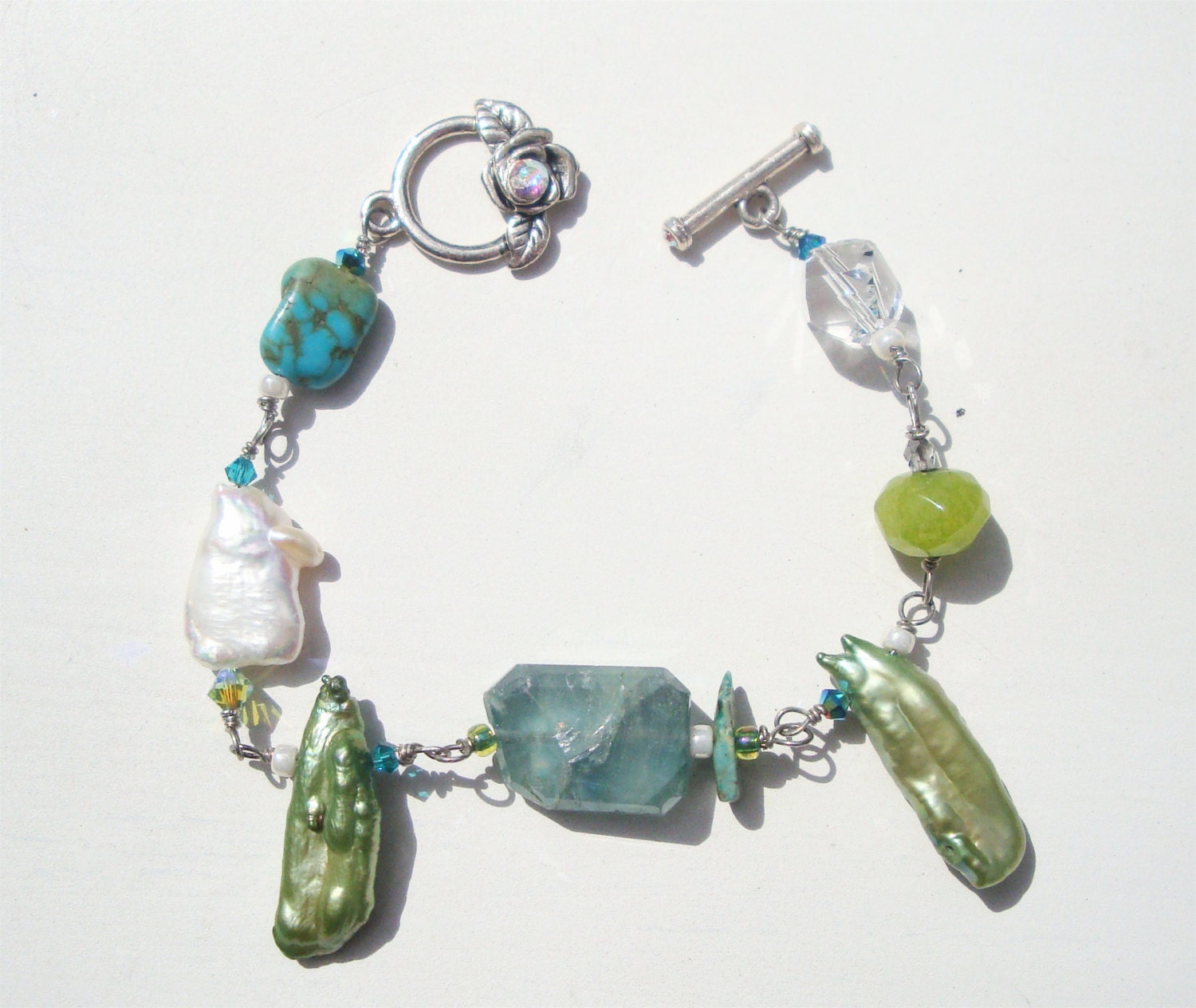 A potpourri of gems and pearl bracelet