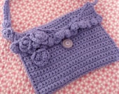 Hand crocheted lavender shoulder bag fully lined with cotton ,interior pockets and embellished with flowers