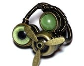 Airship Pirate Steampunk Ring - green taxidermy glass EYE- Brass Propeller - SIZE 11.5 ONLY