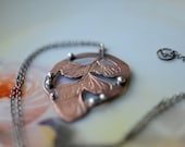 Maidenhair Fern Engraved Necklace with Sterling Silver accents.