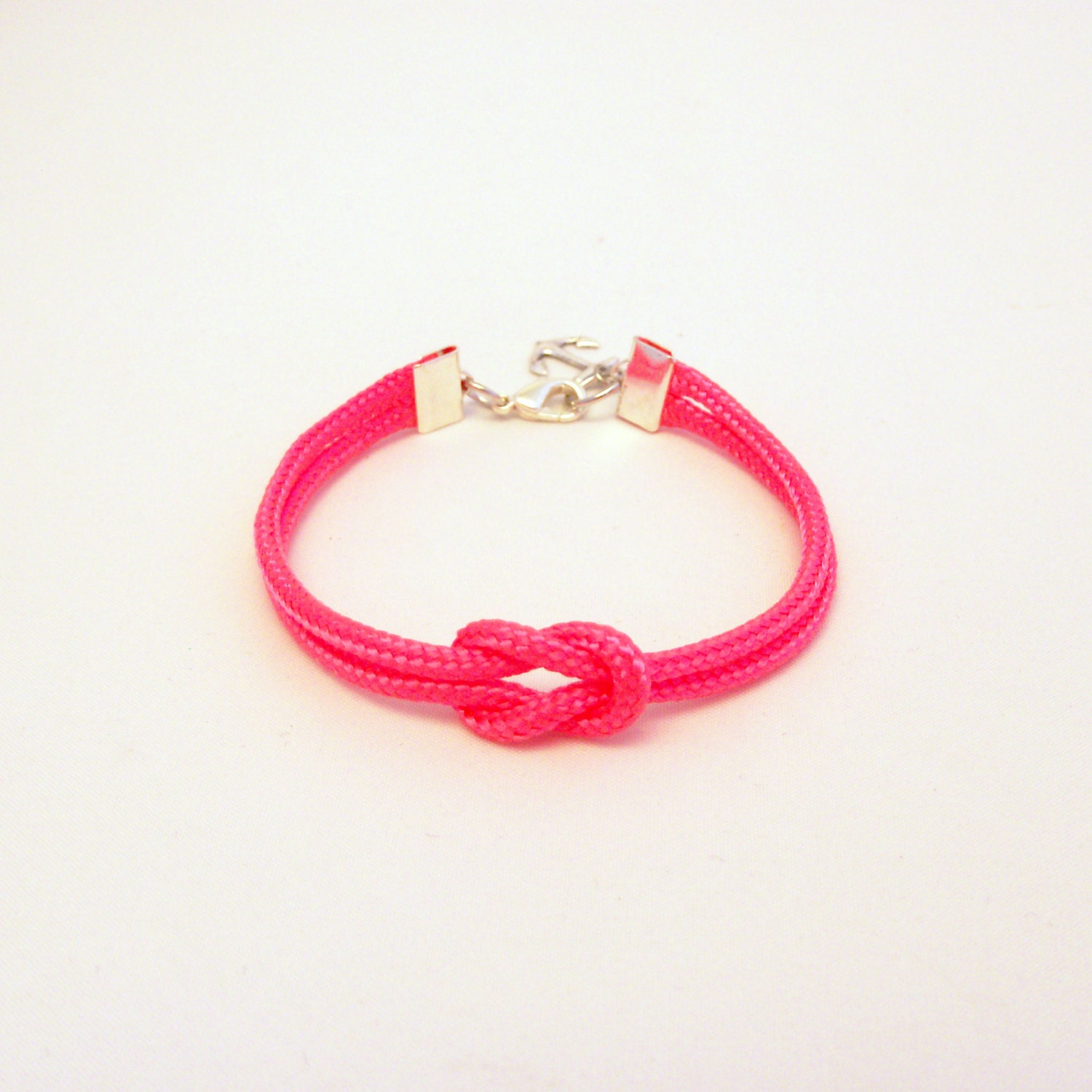 Neon pink forever knot nautical rope bracelet with silver anchor charm