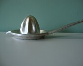 Vintage orange juicer, aluminum kitchen tool, fits over the lip of a cup, Nevco brand