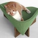 Modern cat bed in sage bouclé upholstery