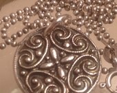 Compass in a filigree design