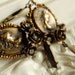 windswept - vintage inspired victorian edwardian aged brass repousse cameo ornate floral rose ivory rhinestone dangle earrings