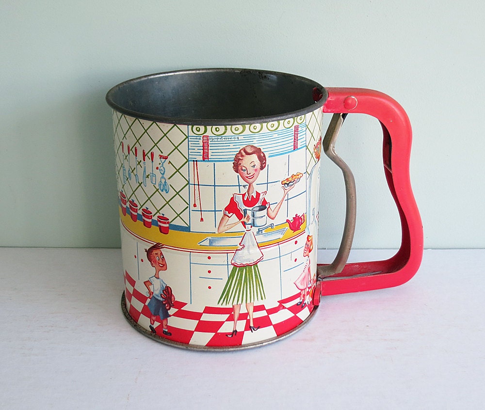 Vintage Androck Hand-i-Sift Flour Sifter with a Mother and Children in the 1950s Kitchen